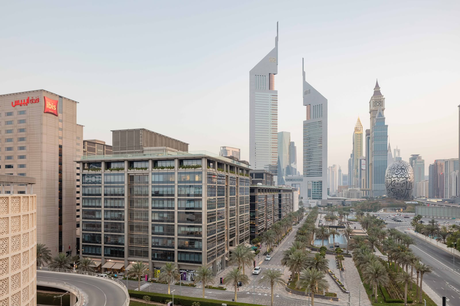 Qualifying free zone person status and the Dubai business district skyline in the UAE